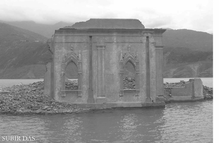 Photograph of a submerged temple structure standing in the reservoir once the dam was functional.