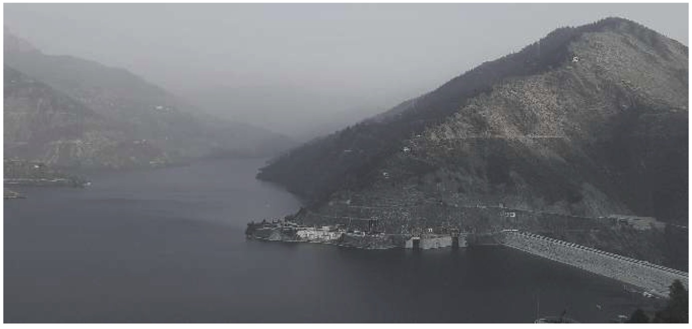 Photograph of the Tehri Dam reservoir set among Himalayan hillsides.